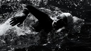 Engaging shot of a swimmer in Viana do Castelo, Portugal during a triathlon.