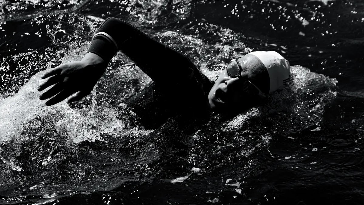 Engaging shot of a swimmer in Viana do Castelo, Portugal during a triathlon.